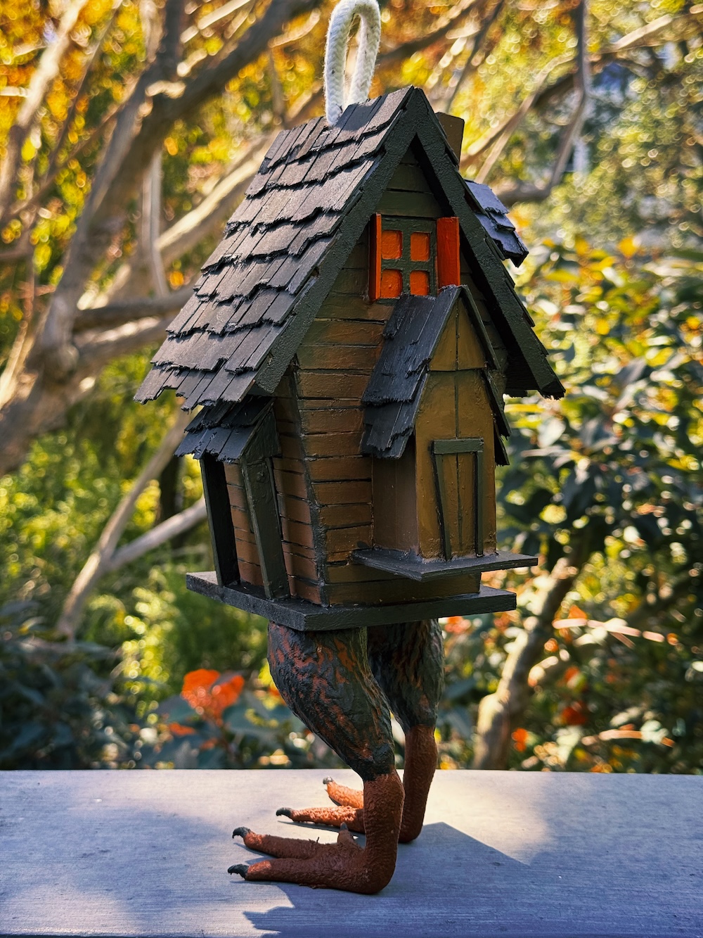 back side of a popsicle sticks hut on chicken legs